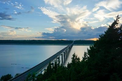 Storm approaches Tuttle Creek State Park during sunset. The Mile Long Bridge stretches over Tuttle Creek Lake on Tuesday.